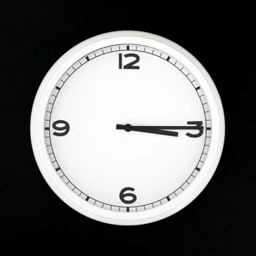 White round analog wall clock isolated on black background. Stock Photos