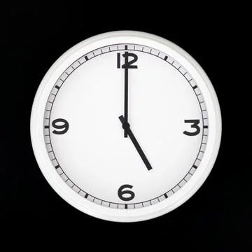 White round analog wall clock isolated on black background. Stock Photos