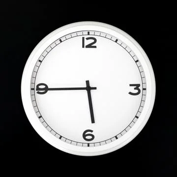 White round analog wall clock isolated on black background. Stock Photos