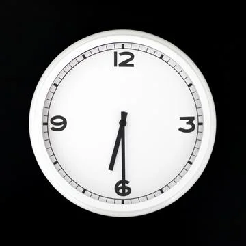 White round analog wall clock isolated on black background. Stock Photos