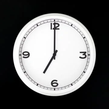 White round analog wall clock isolated on black background. Stock Photos