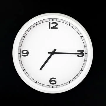 White round analog wall clock isolated on black background. Stock Photos