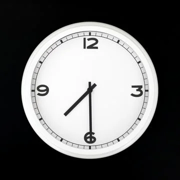 White round analog wall clock isolated on black background. Stock Photos