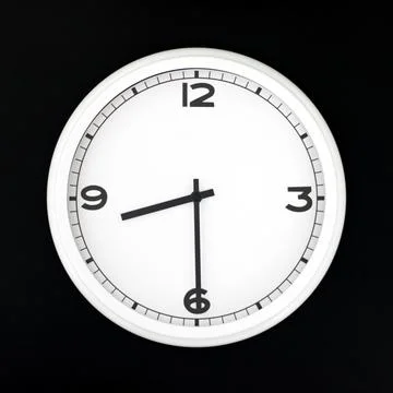 White round analog wall clock isolated on black background. Stock Photos