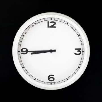 White round analog wall clock isolated on black background. Stock Photos
