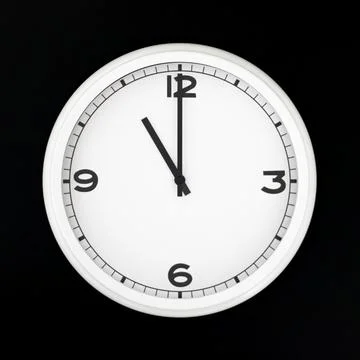 White round analog wall clock isolated on black background. Stock Photos