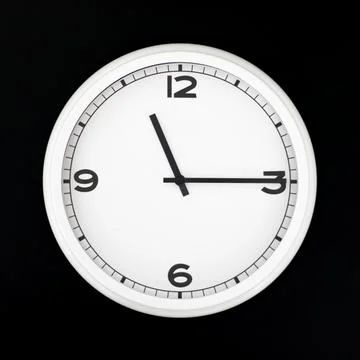 White round analog wall clock isolated on black background. Stock Photos