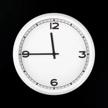 White round analog wall clock isolated on black background. Stock Photos
