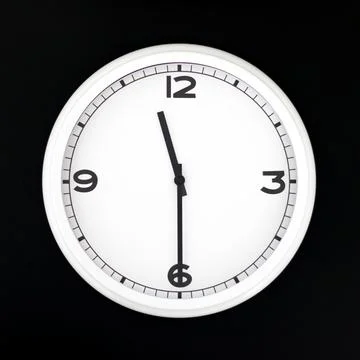 White round analog wall clock isolated on black background. Stock Photos