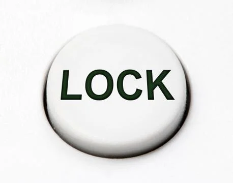 A white round button switch - lock, close up. Stock Photos