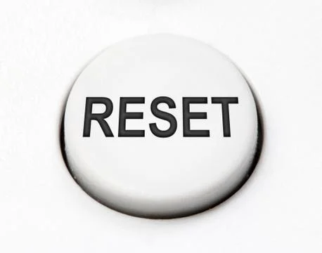 A white round button switch for reset close up. Control mechanical key Stock Photos