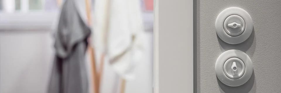 White round light switch Stock Photos