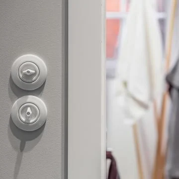 White round light switch Stock Photos