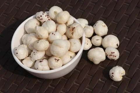 White round nut with brown background Stock Photos