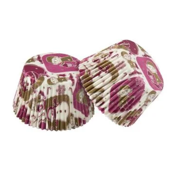 White round paper baking forms for muffins and cupcakes with Christmas patter Stock Photos