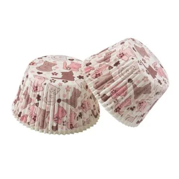 White round paper baking forms for muffins and cupcakes with cats pattern Foto stock