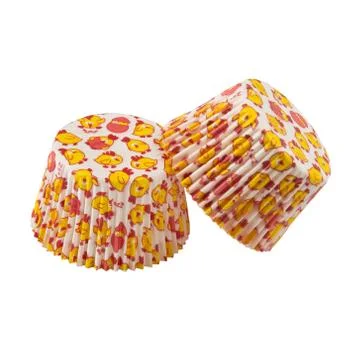 White round paper baking forms for muffins and cupcakes with chicken pattern Stock Photos