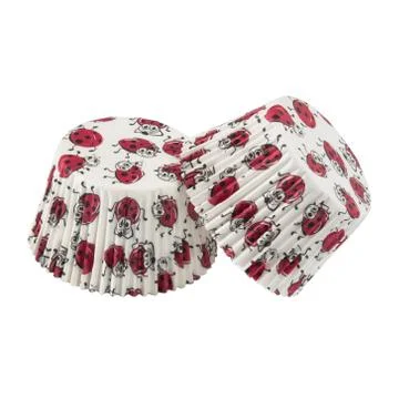 White round paper baking forms for muffins and cupcakes with ladybirds patter Stock Photos