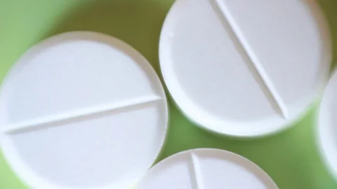White round pills. Macro focus Vídeo Stock 88764443