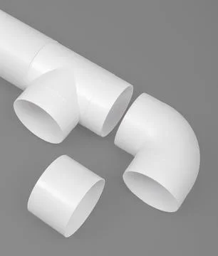 White round plastic pipe on a gray background. Ventilation system. Stock Photos