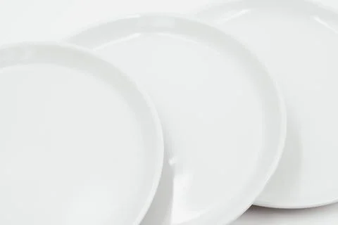 White round plate on white background copy space Stock Photos
