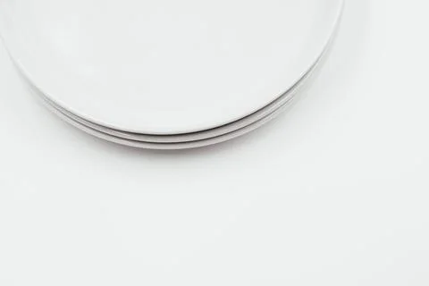 White round plate on white background copy space Stock Photos