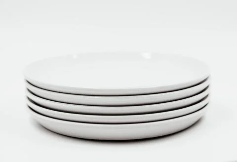 White round plate on white background copy space Stock Photos