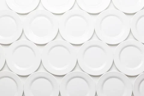 White round plates pattern, isolated on white background Foto stock