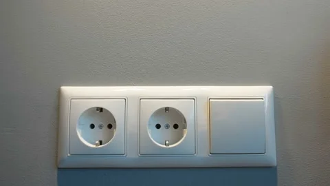 A white round plug wall socket in Estonia Stock Footage 200596315