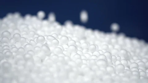 White round polystyrene packaging material drop in slow motion Stock Footage 119767482