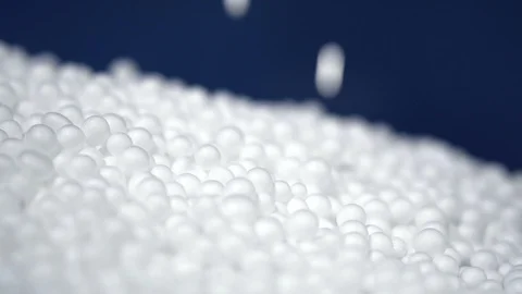 White round polystyrene packaging material drop in slow motion Stock Footage 119767527