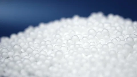White round polystyrene packaging material drop in slow motion Stock Footage 119767566