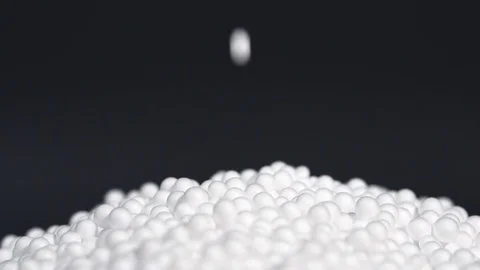 White round polystyrene packaging material drop in slow motion Stock Footage 119767840