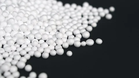 White round polystyrene packaging material drop in slow motion Stock Footage 119767914