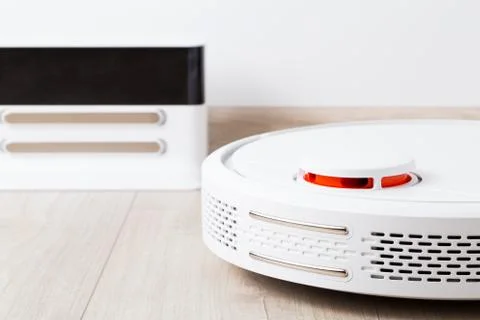 White round robot vacuum cleaner Foto stock