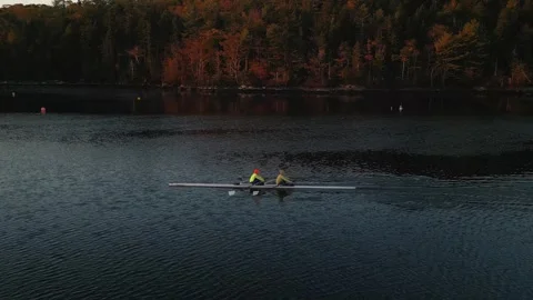 White rowing boat in motion with two women, aerial view. Canada, Halifax. Video stock 257036036