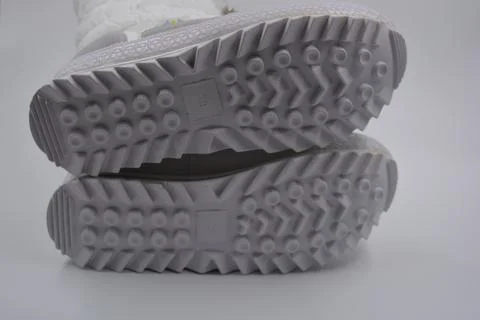 A white rubber sole with an interesting pattern from the new white boot. 스톡 사진