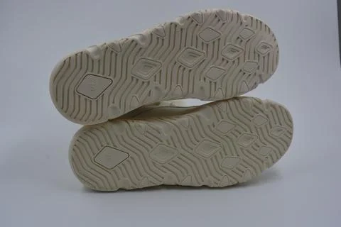 A white rubber sole with pattern from the new white sneakers. 스톡 사진