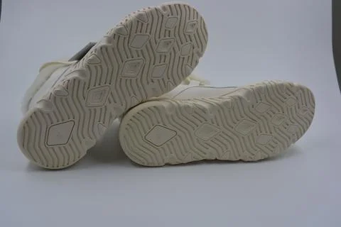 A white rubber sole with pattern from the new white sneakers. 스톡 사진