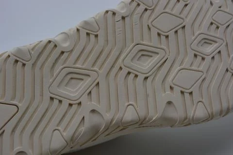A white rubber sole with pattern from the new white sneakers. 스톡 사진
