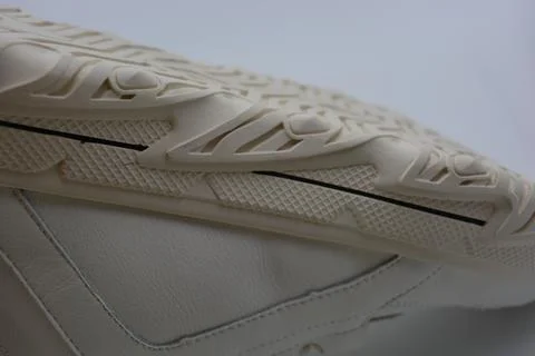 A white rubber sole with pattern from the new white sneakers. 스톡 사진