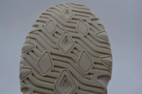 A white rubber sole with pattern from the new white sneakers. 스톡 사진