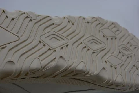 A white rubber sole with pattern from the new white sneakers. Stock Photos