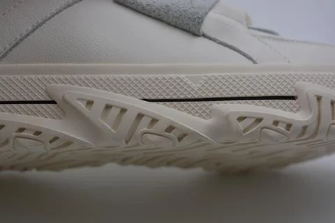 A white rubber sole with pattern from the new white sneakers. 스톡 사진