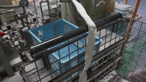 White Rubber Strip Feeding Into Ball Molding Machine With Baskets Vídeo Stock 339736463