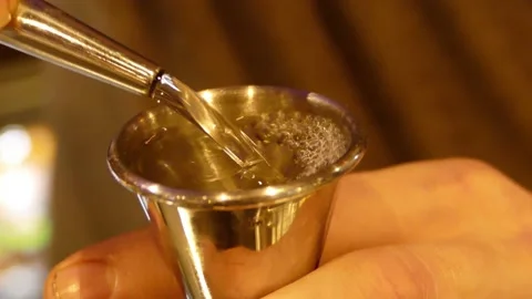 White Rum Poured Into Bar Jigger Whilst Making A Cocktail Vídeos de archivo 133254672