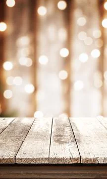 White rustic table with bokeh Christmas lights in the background, front view, Stock Photos