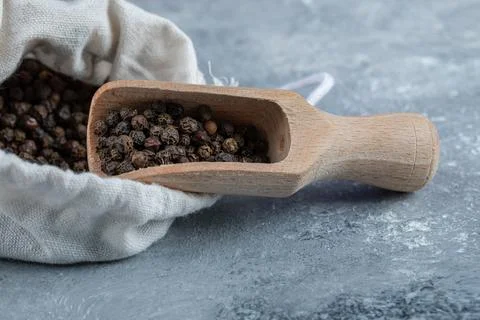 A white sack full of dried pepper on a marble background Stock Photos