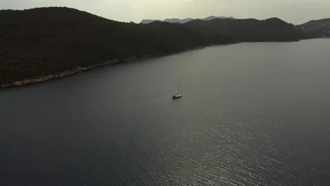 White sailing boat with mountain scenery Stock Footage 195030694