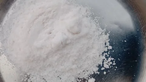 White salt placed in a plate on table Stock-Footage 347628309